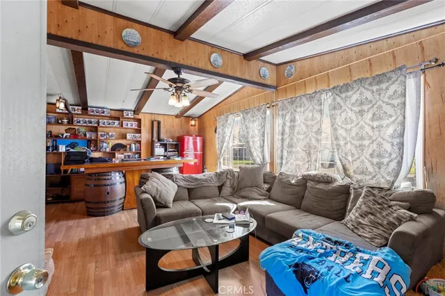 a living room with furniture a rug and a table
