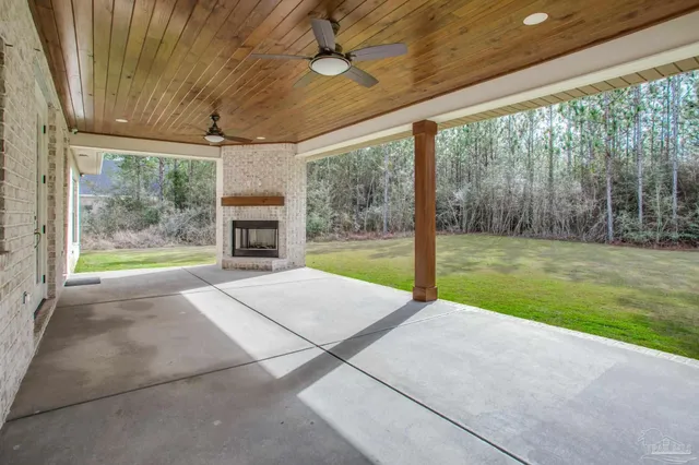 a large kitchen with a table and chairs
