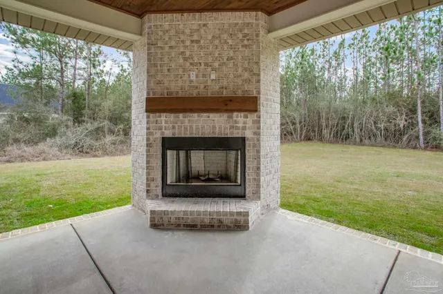 a view of a backyard with sitting area