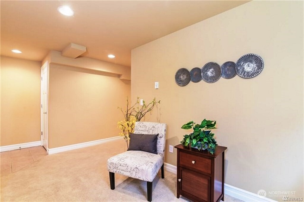 725 North 95th Street, Unit C Seattle, WA 98103 - Photo 16 of 18 a living room with furniture and a potted plant