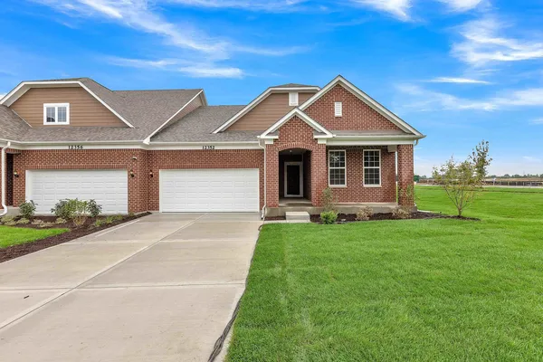 a front view of a house with yard