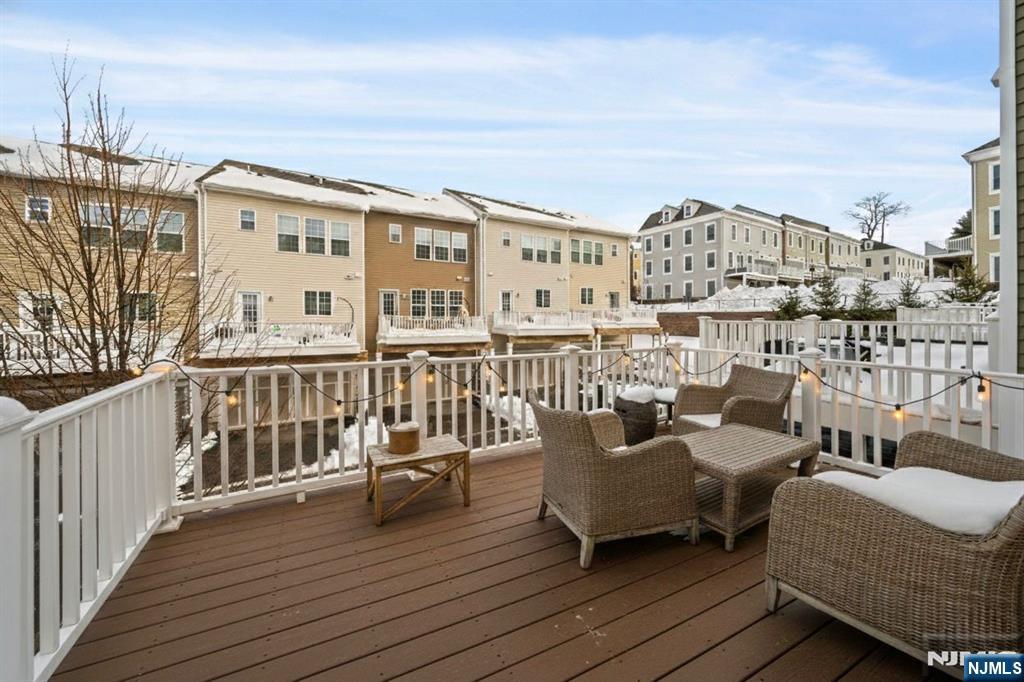 84 Truman Drive, Unit 2801 Wood-Ridge, NJ 07075 - Photo 13 of 46 a view of a balcony with chairs