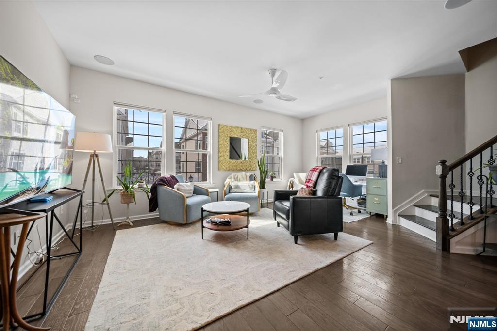 84 Truman Drive, Unit 2801 Wood-Ridge, NJ 07075 - Photo 20 of 46 a living room with furniture and a large window