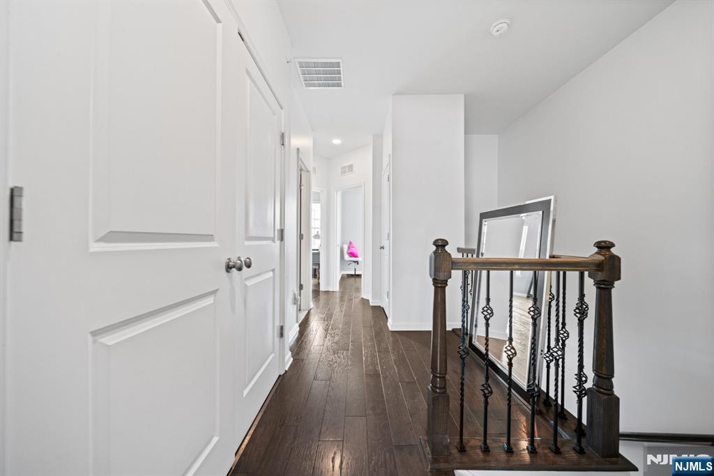 84 Truman Drive, Unit 2801 Wood-Ridge, NJ 07075 - Photo 22 of 46 a view of hallway with wooden floor