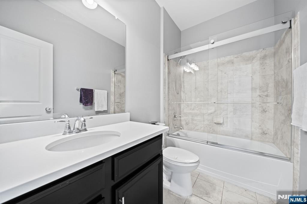 84 Truman Drive, Unit 2801 Wood-Ridge, NJ 07075 - Photo 31 of 46 a bathroom with a sink a toilet and shower