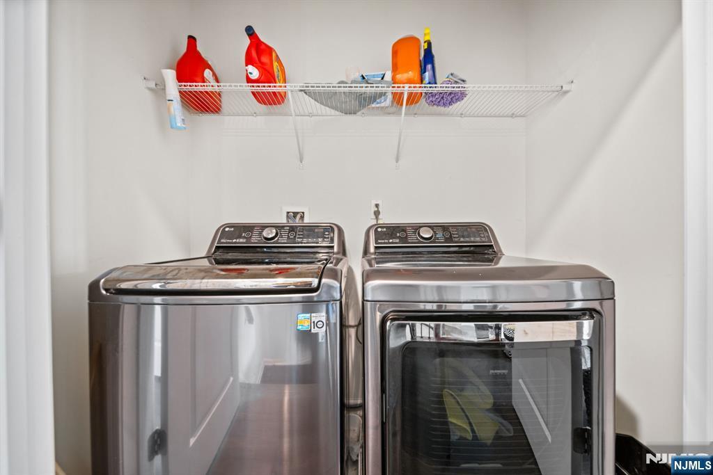 84 Truman Drive, Unit 2801 Wood-Ridge, NJ 07075 - Photo 32 of 46 a utility room with dryer and washer