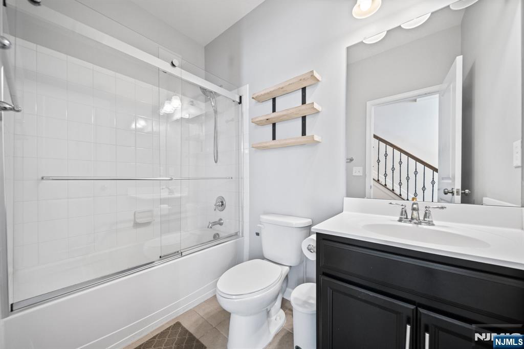84 Truman Drive, Unit 2801 Wood-Ridge, NJ 07075 - Photo 5 of 46 a bathroom with a sink toilet vanity and shower