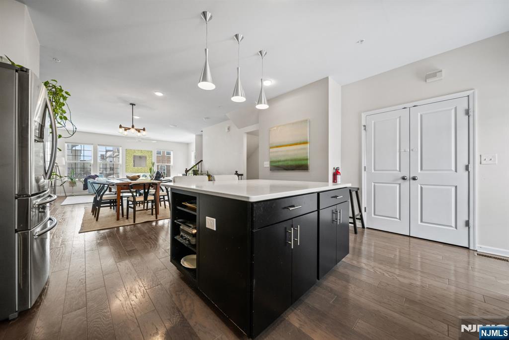 84 Truman Drive, Unit 2801 Wood-Ridge, NJ 07075 - Photo 9 of 46 a kitchen with stainless steel appliances granite countertop a stove and a refrigerator