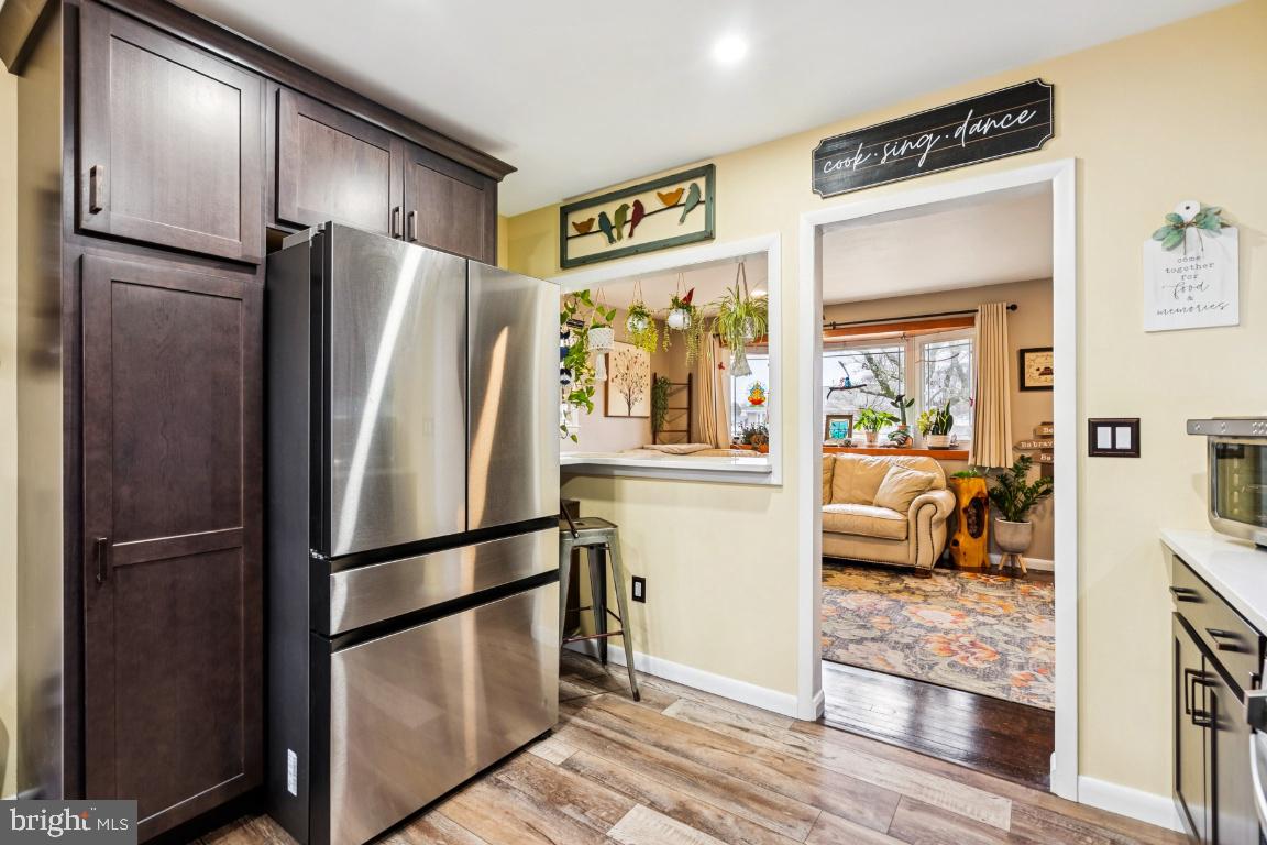 146 Country Club Road Pine Hill, NJ 08021 - Photo 11 of 28 a kitchen with stainless steel appliances granite countertop a refrigerator and a sink