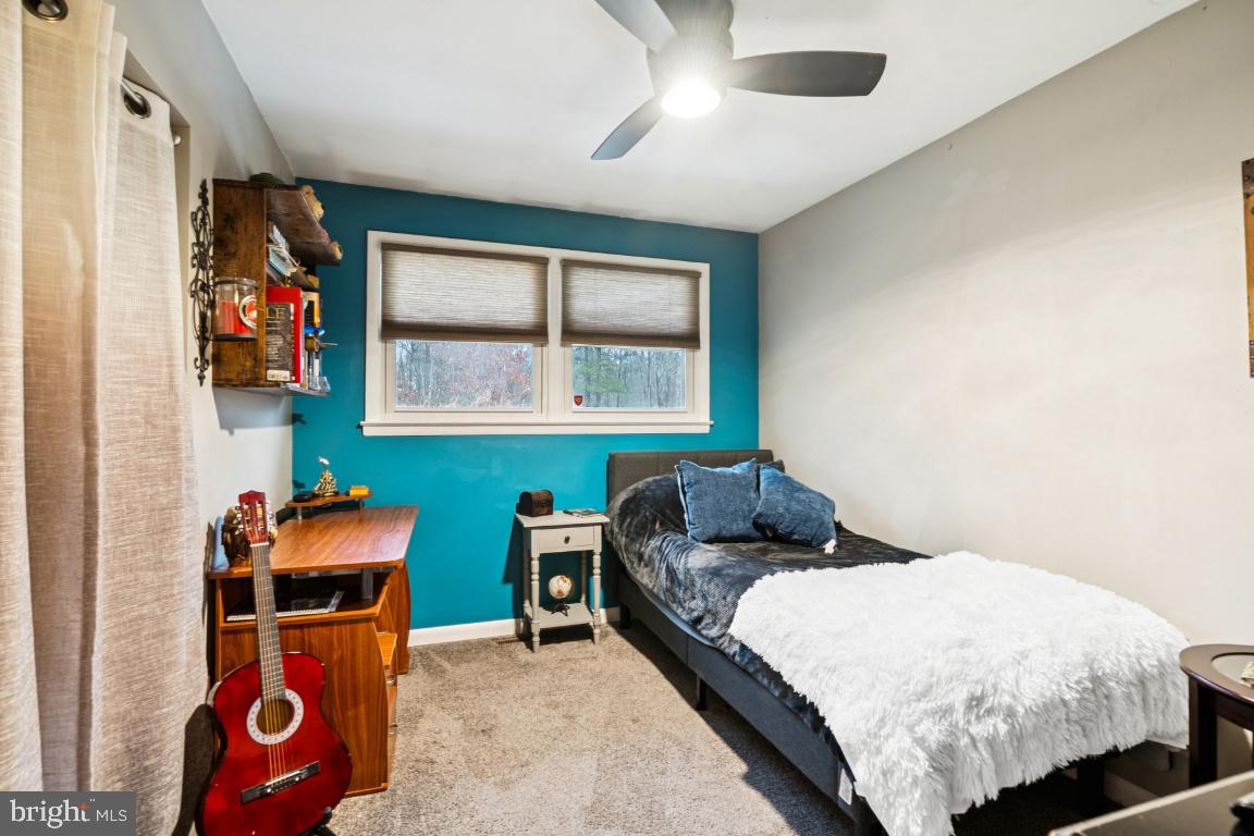 146 Country Club Road Pine Hill, NJ 08021 - Photo 12 of 28 a bed room with a bed and a chair
