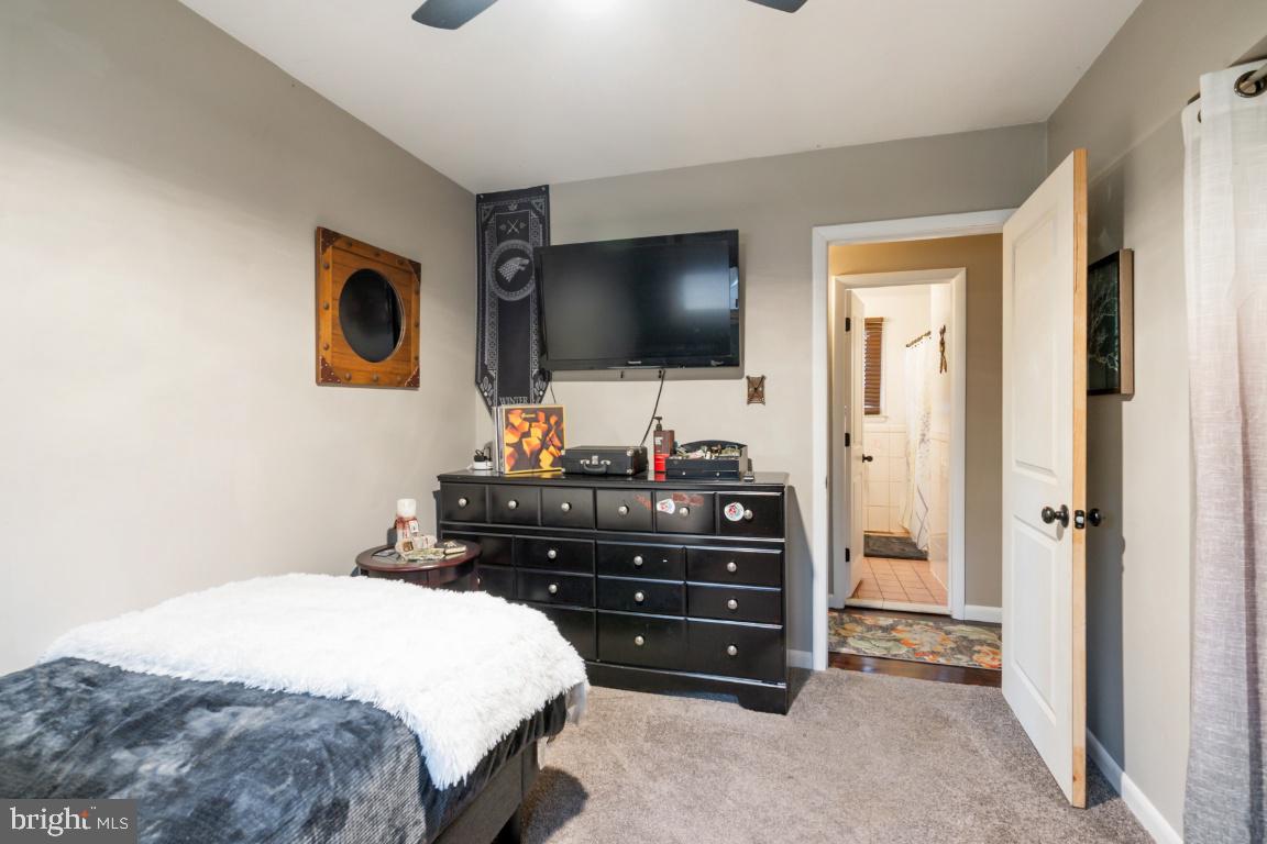 146 Country Club Road Pine Hill, NJ 08021 - Photo 14 of 28 a bedroom with a bed and a flat screen tv