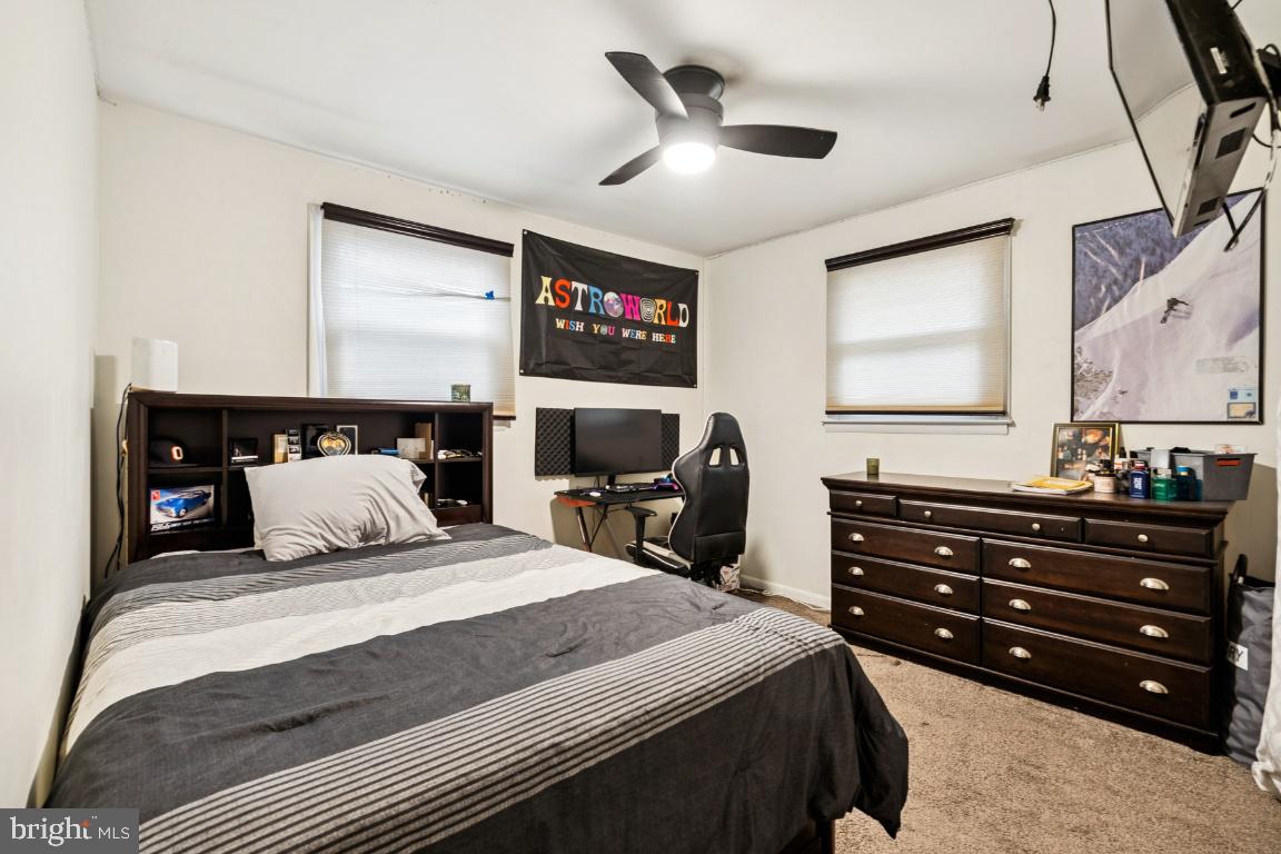 146 Country Club Road Pine Hill, NJ 08021 - Photo 15 of 28 a bedroom with a bed and wooden floor