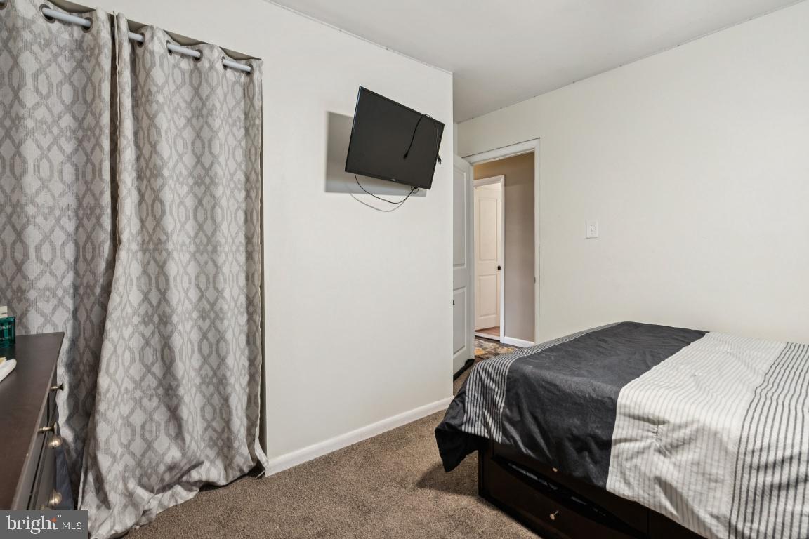 146 Country Club Road Pine Hill, NJ 08021 - Photo 16 of 28 a bedroom with a bed and a flat screen tv
