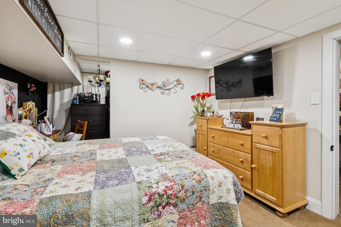 146 Country Club Road Pine Hill, NJ 08021 - Photo 20 of 28 a bedroom with a bed and a flat screen tv