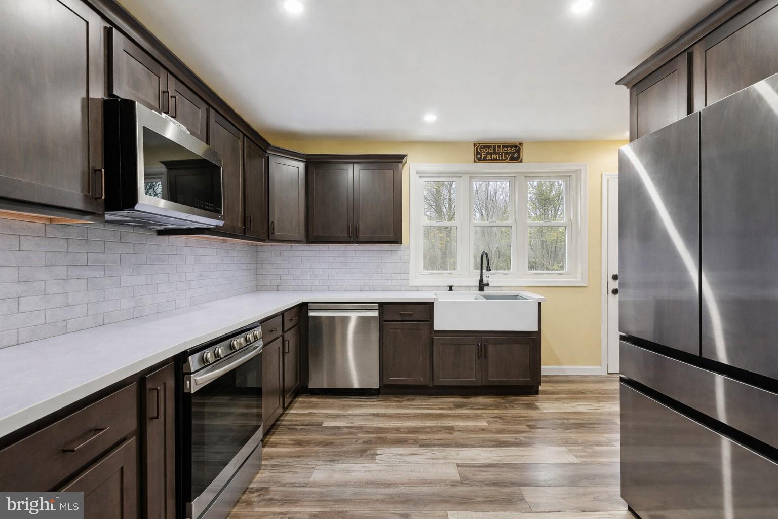 146 Country Club Road Pine Hill, NJ 08021 - Photo 8 of 28 a kitchen with stainless steel appliances a refrigerator sink and microwave