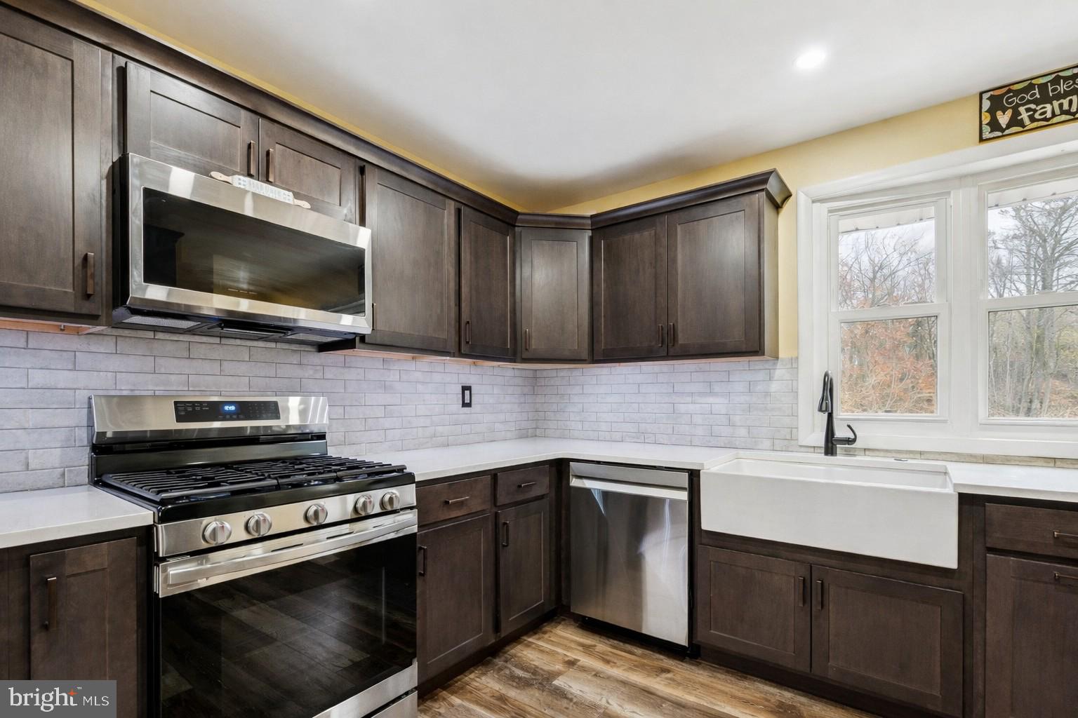 146 Country Club Road Pine Hill, NJ 08021 - Photo 9 of 28 a kitchen with a sink stove and microwave