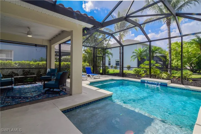 a view of a swimming pool with a patio
