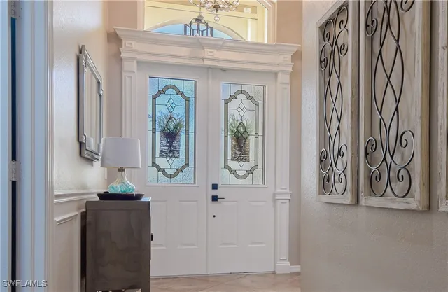 a view of front door with wooden door