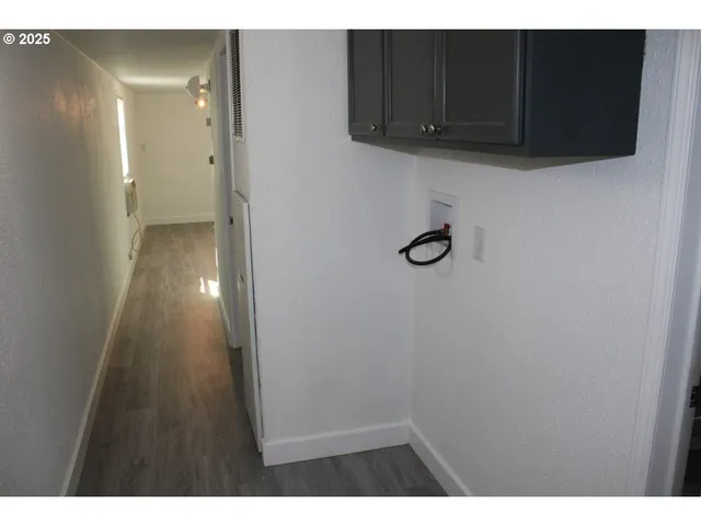 a view of a kitchen from the hallway