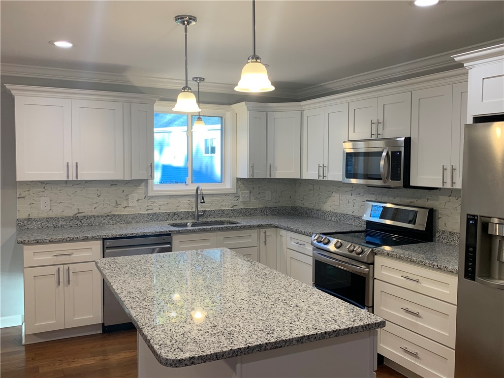 1520 Chopmist Hill Road Scituate, RI 02857 - Photo 3 of 11 Kitchen Island, Granite counters and Backsplash are upgrades.