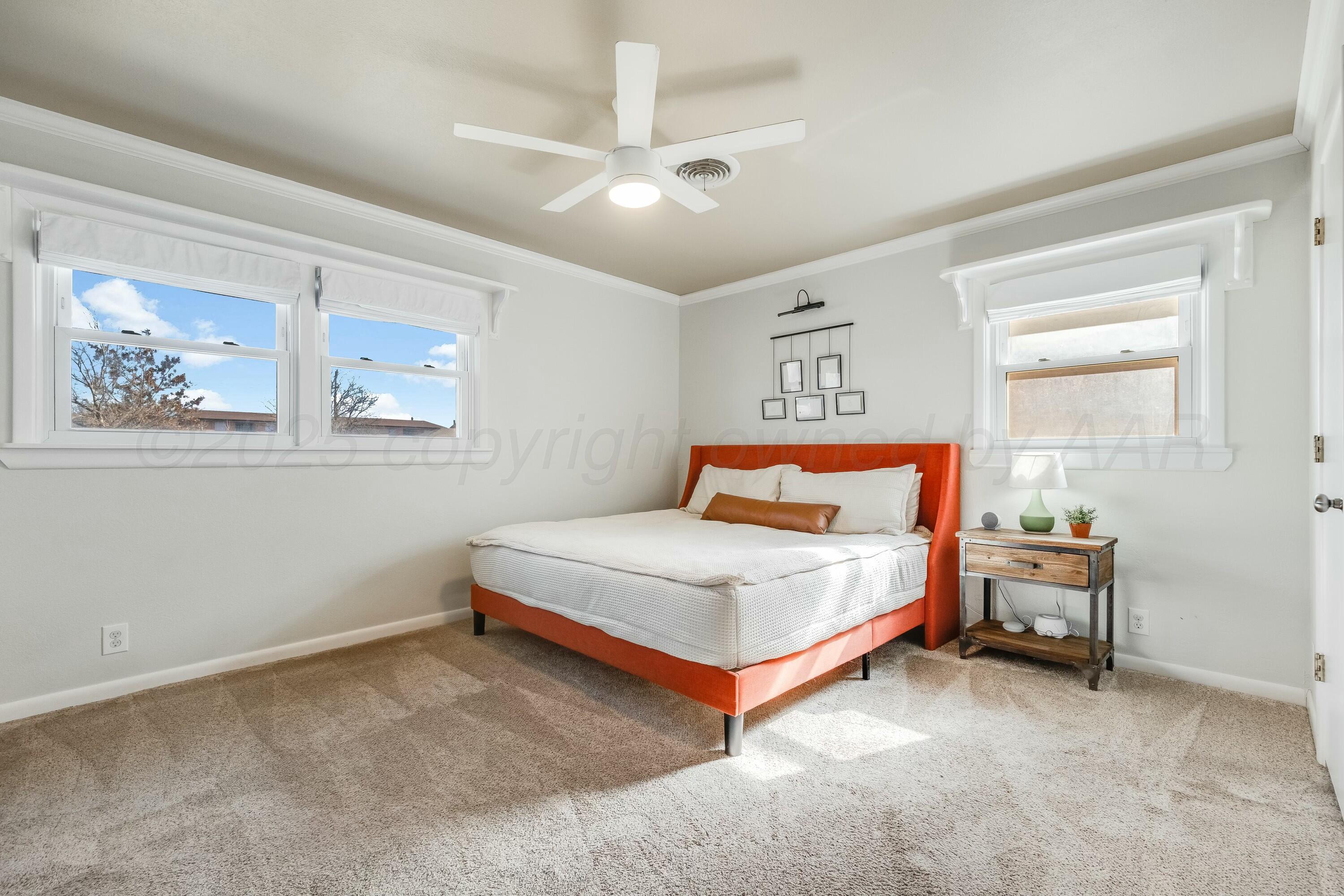 3128 Nebraska Street Amarillo, TX 79106 - Photo 16 of 34 a bedroom with a bed and a window