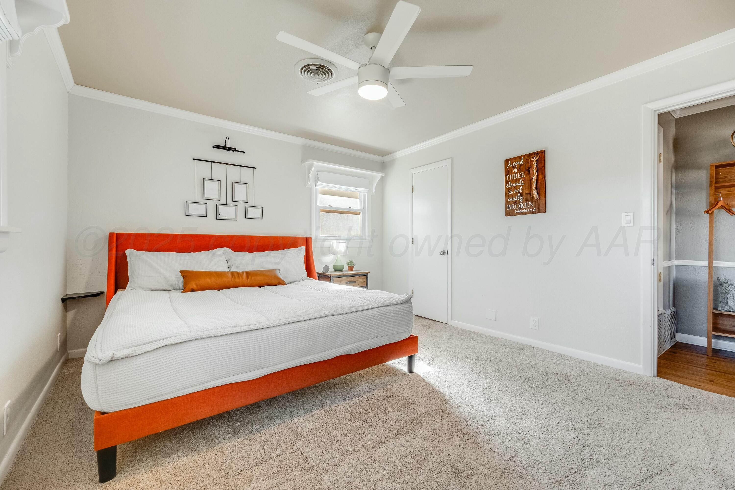 3128 Nebraska Street Amarillo, TX 79106 - Photo 17 of 34 a bedroom with a bed and a painting on the wall