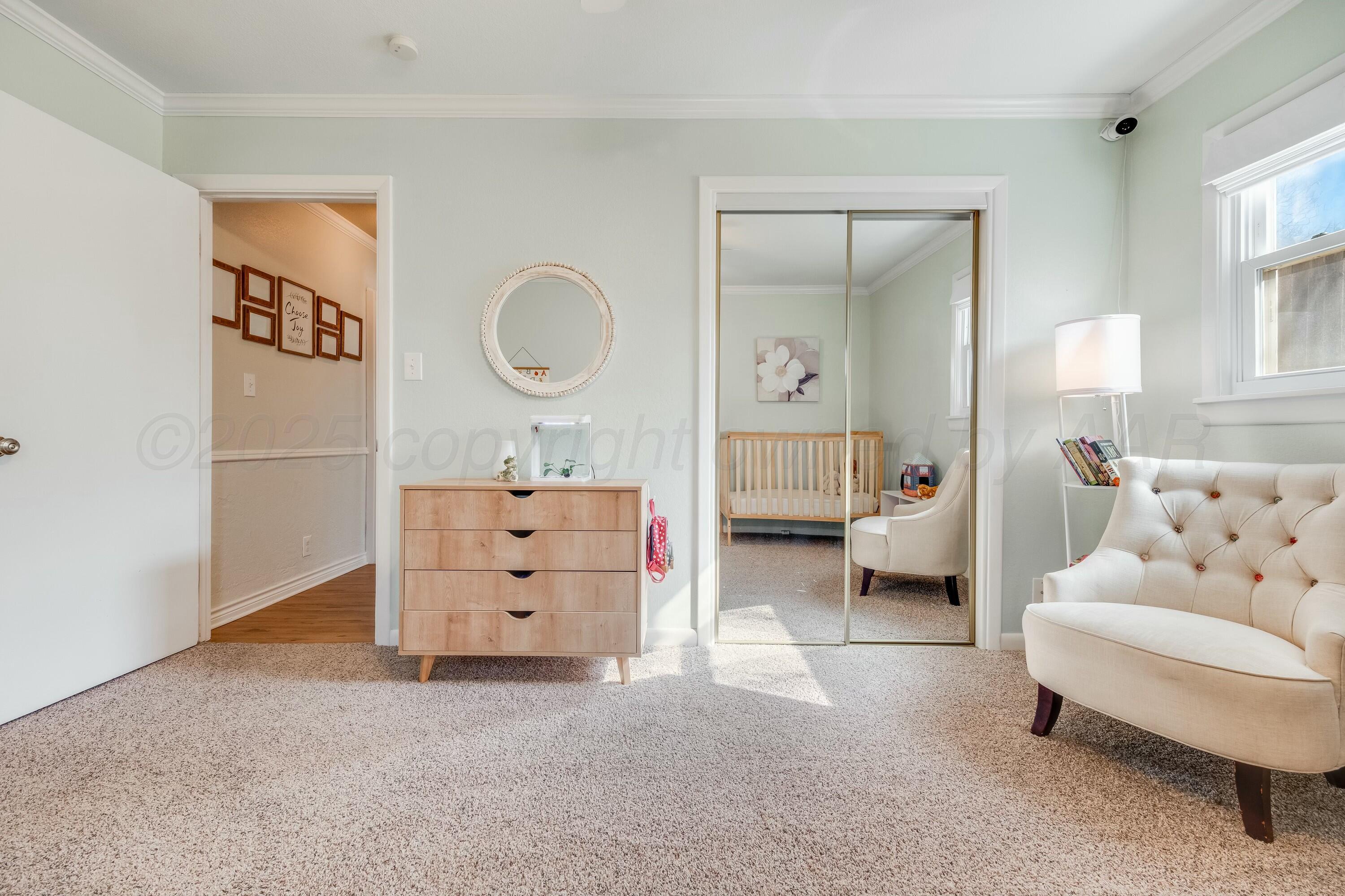 3128 Nebraska Street Amarillo, TX 79106 - Photo 20 of 34 a living room with furniture and a mirror