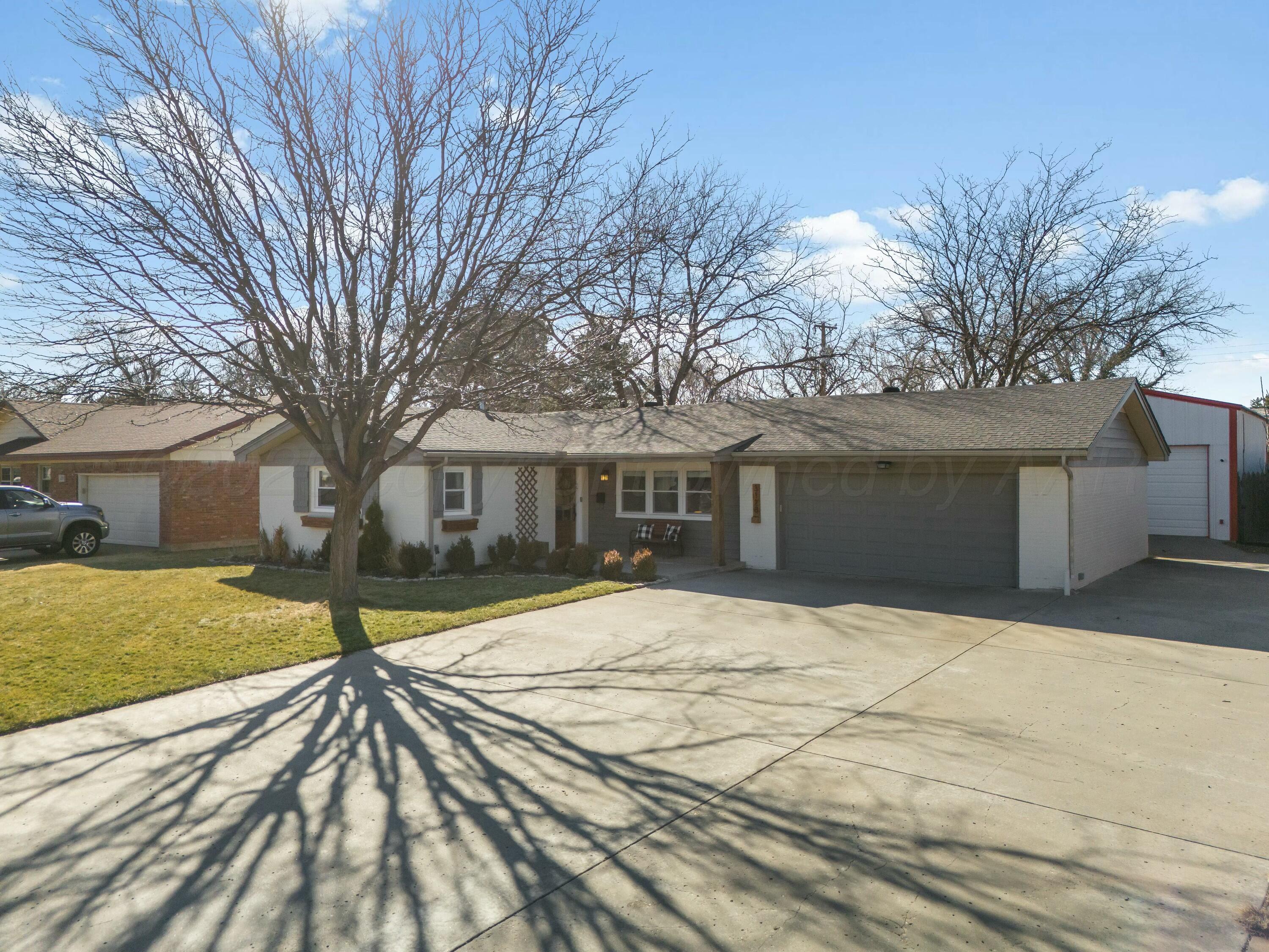 3128 Nebraska Street Amarillo, TX 79106 - Photo 2 of 34 a house with trees in front of it