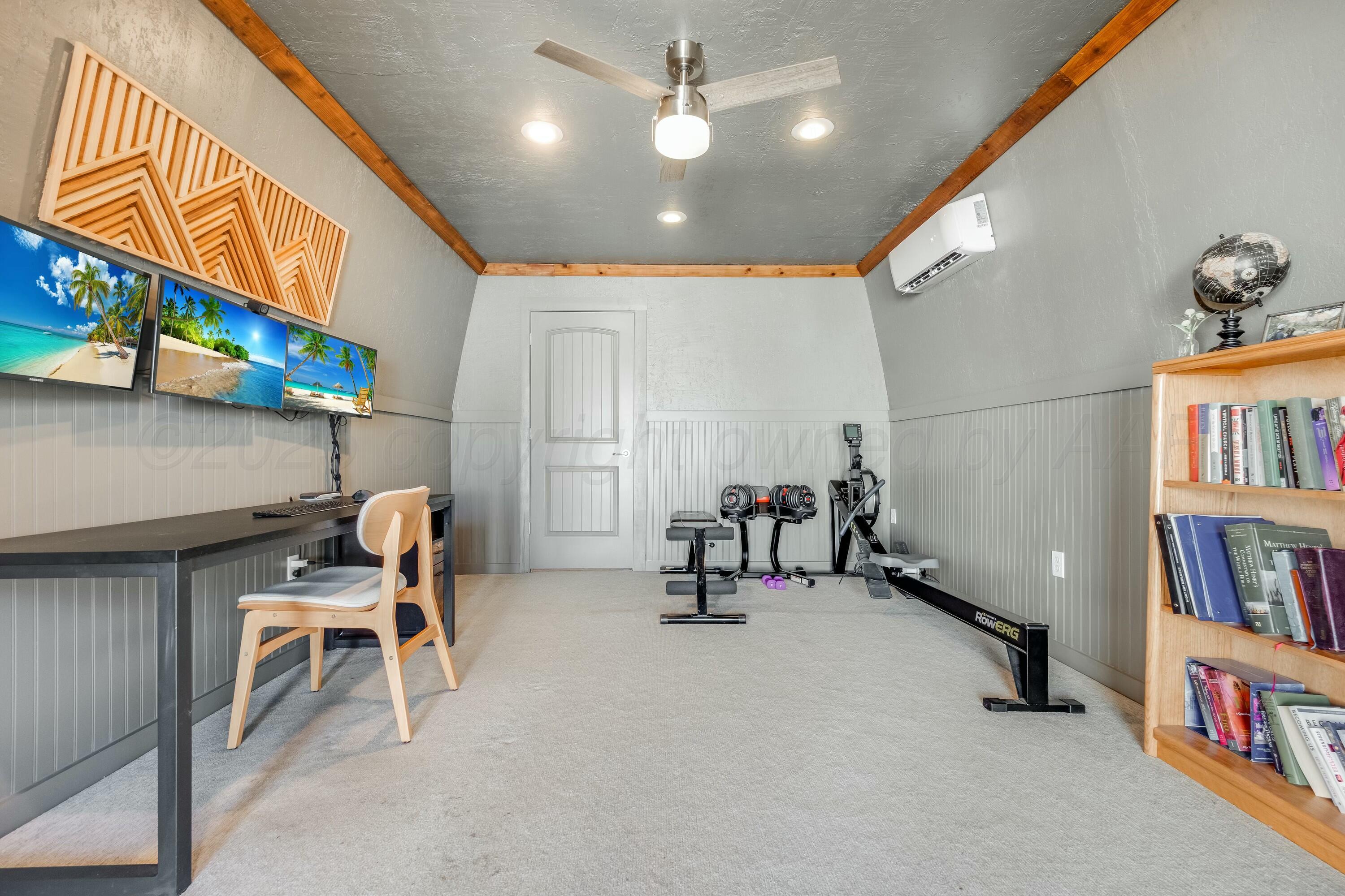 3128 Nebraska Street Amarillo, TX 79106 - Photo 26 of 34 a room with furniture and a book shelf