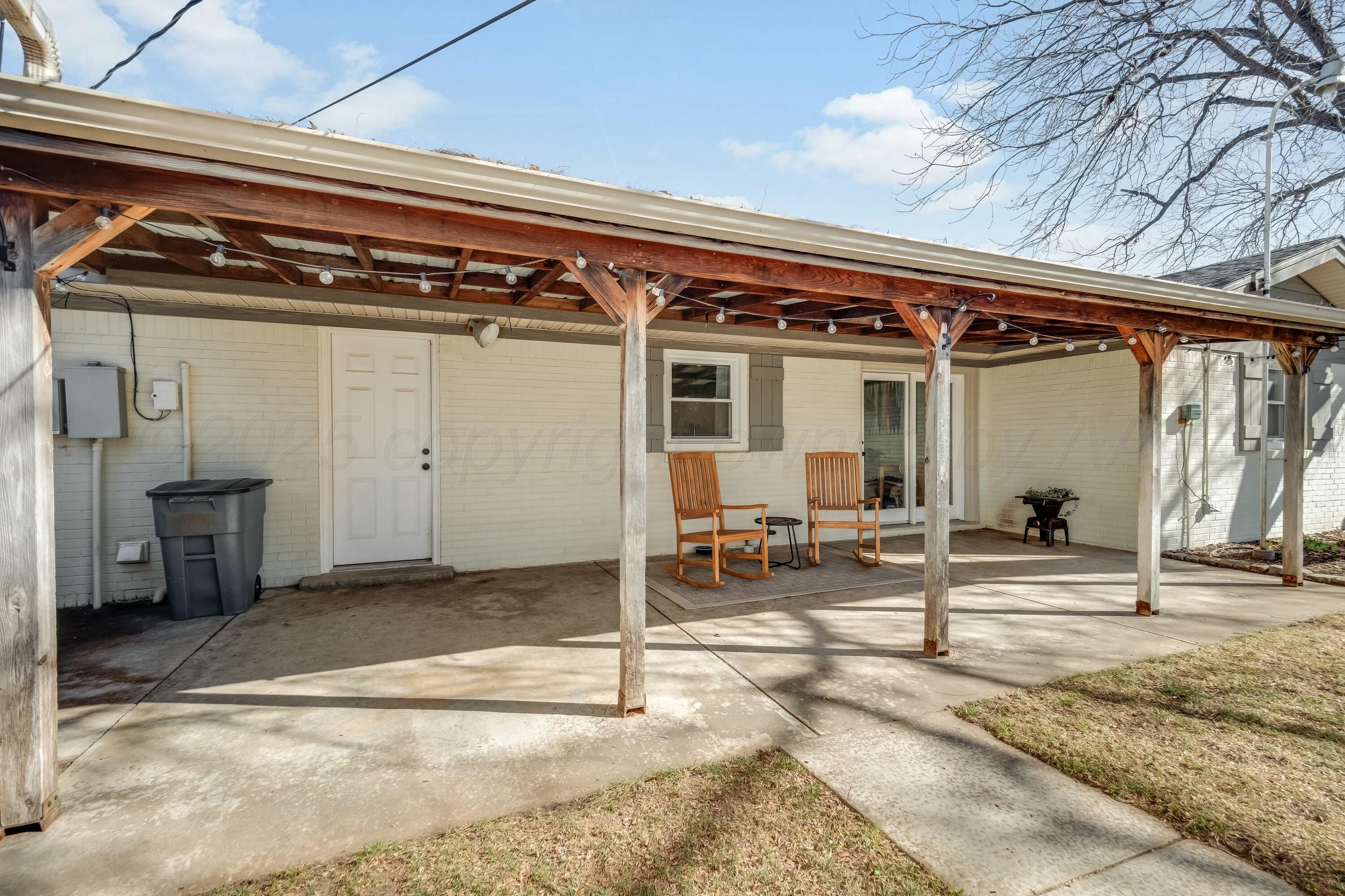 3128 Nebraska Street Amarillo, TX 79106 - Photo 28 of 34 a view of a porch with table and chairs