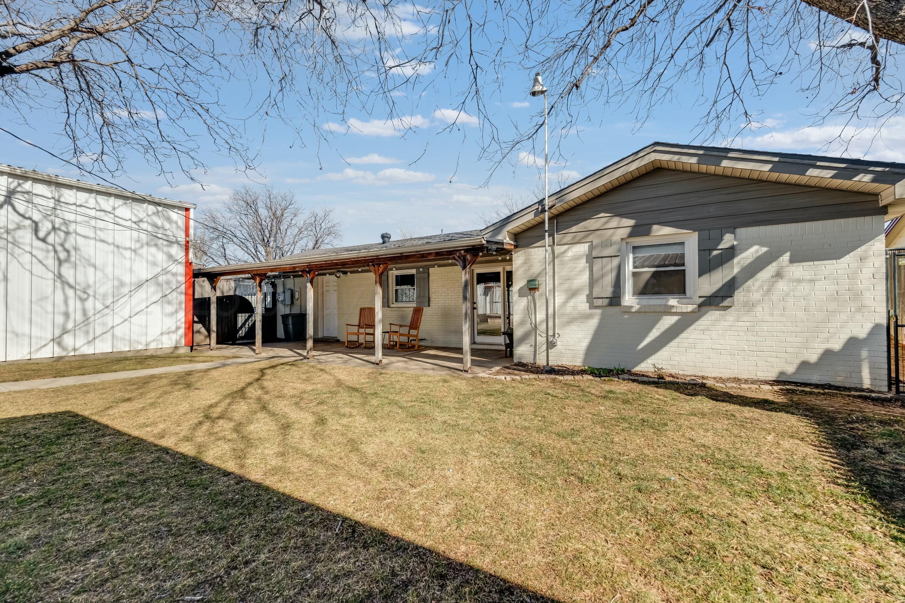 3128 Nebraska Street Amarillo, TX 79106 - Photo 29 of 34 a front view of a house with a yard