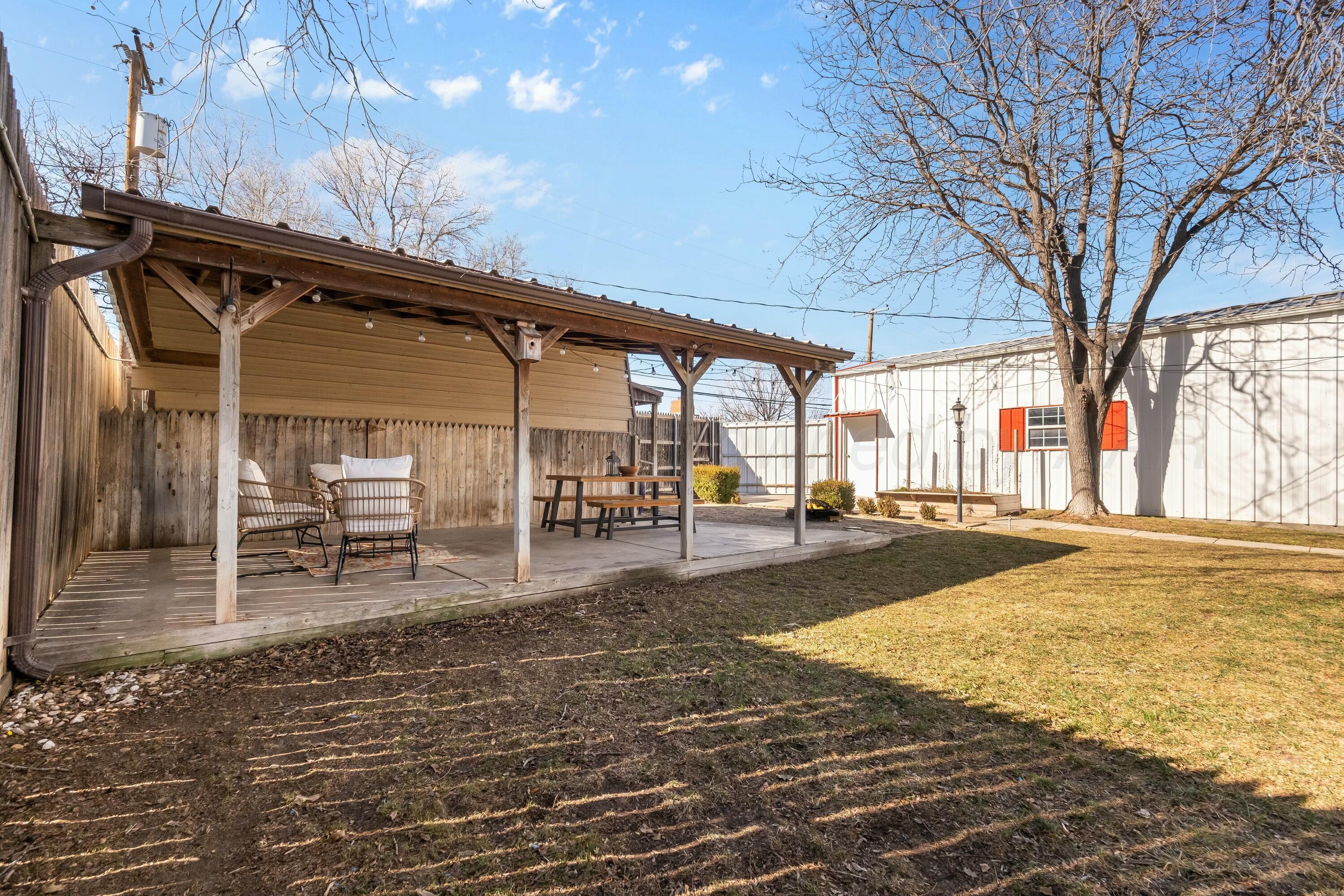 3128 Nebraska Street Amarillo, TX 79106 - Photo 31 of 34 a swimming pool with outdoor seating and yard