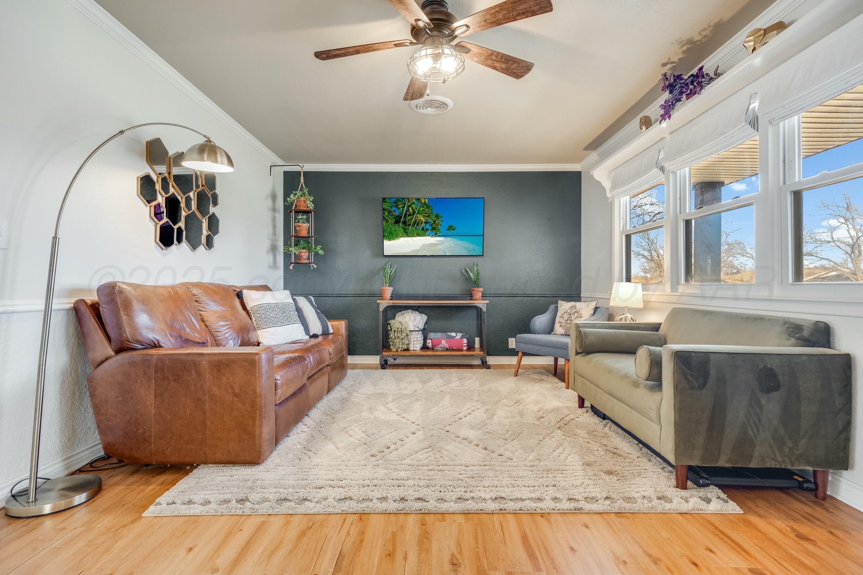 3128 Nebraska Street Amarillo, TX 79106 - Photo 7 of 34 a living room with furniture and a fireplace