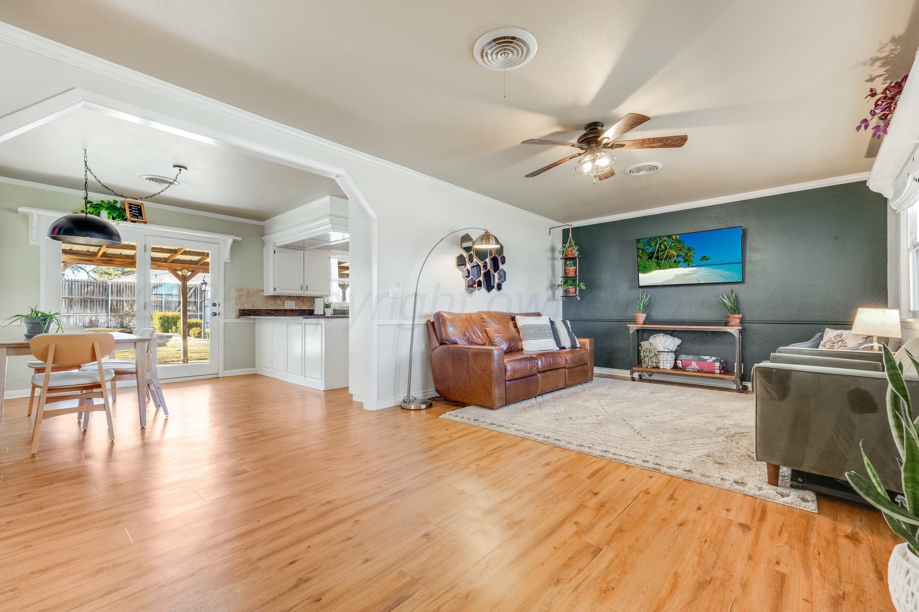 3128 Nebraska Street Amarillo, TX 79106 - Photo 8 of 34 a living room with furniture and wooden floor