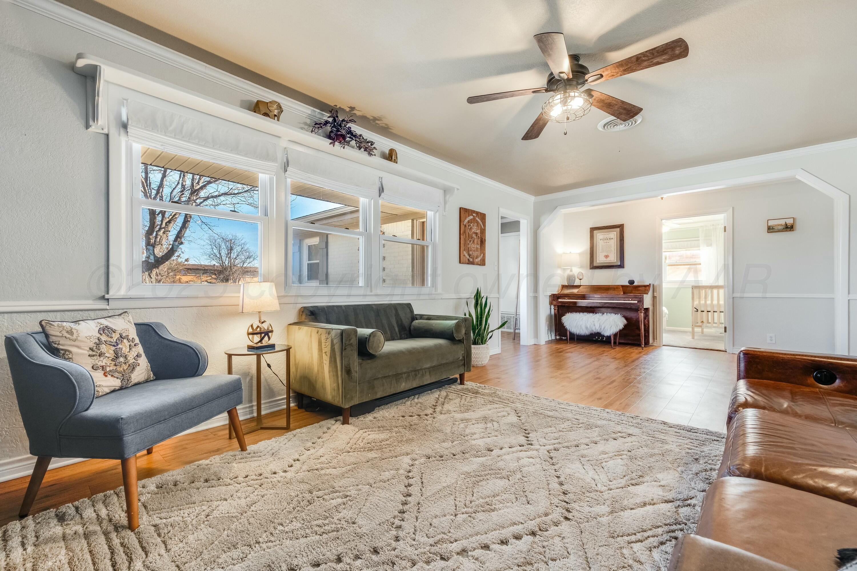 3128 Nebraska Street Amarillo, TX 79106 - Photo 9 of 34 a living room with furniture and a large window