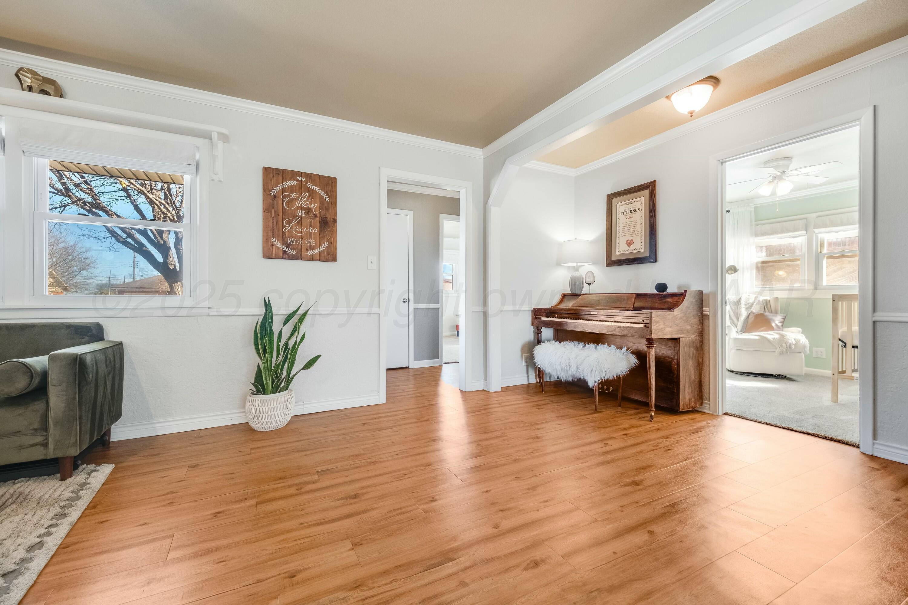 3128 Nebraska Street Amarillo, TX 79106 - Photo 10 of 34 a view of livingroom with furniture window and wooden floor
