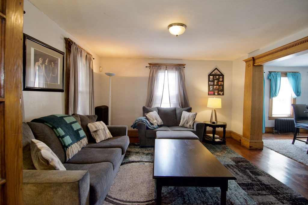 16 Amity Court Springfield, MA 01108 - Photo 7 of 42 a living room with furniture rug and wooden floor