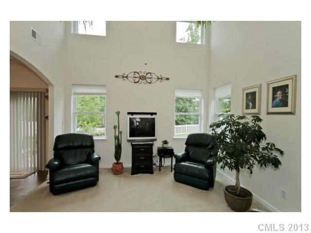 3342 Streamside Drive Davidson, NC 28036 - Photo 2 of 16 a living room with furniture and a flat screen tv