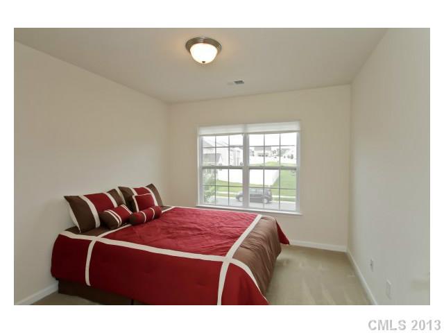 3342 Streamside Drive Davidson, NC 28036 - Photo 12 of 16 a bedroom with a bed and window
