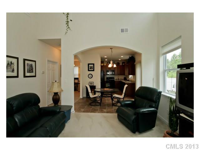 3342 Streamside Drive Davidson, NC 28036 - Photo 3 of 16 a living room with furniture and a flat screen tv