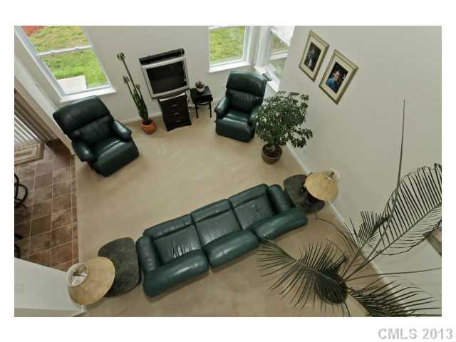 3342 Streamside Drive Davidson, NC 28036 - Photo 4 of 16 a living room with furniture and a flat screen tv