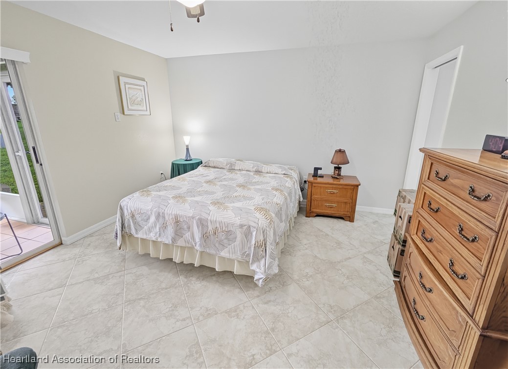 4500 Del Rio Court Sebring, FL 33875 - Photo 14 of 32 Nice master bedroom with access to screened porch