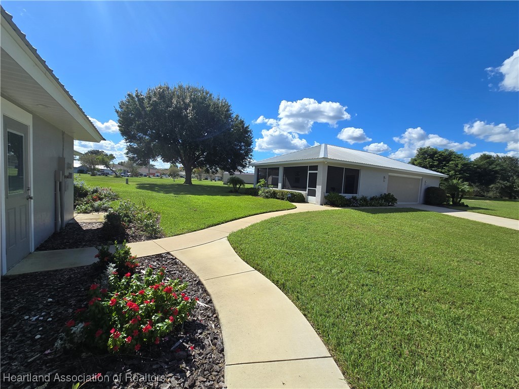 4500 Del Rio Court Sebring, FL 33875 - Photo 25 of 32 Follow the concrete walkway to the detached workshop