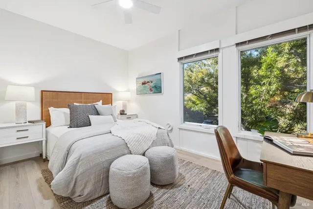 a bed room with a bed and a chair