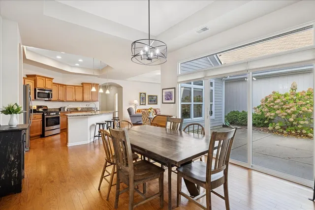 a view of a dining room with furniture and wooden floor