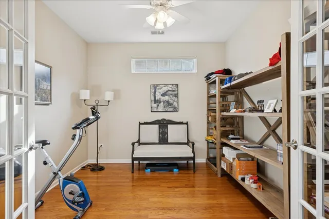 a living room with furniture a rug and a wooden floor