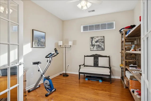 a living room with furniture a rug and a window