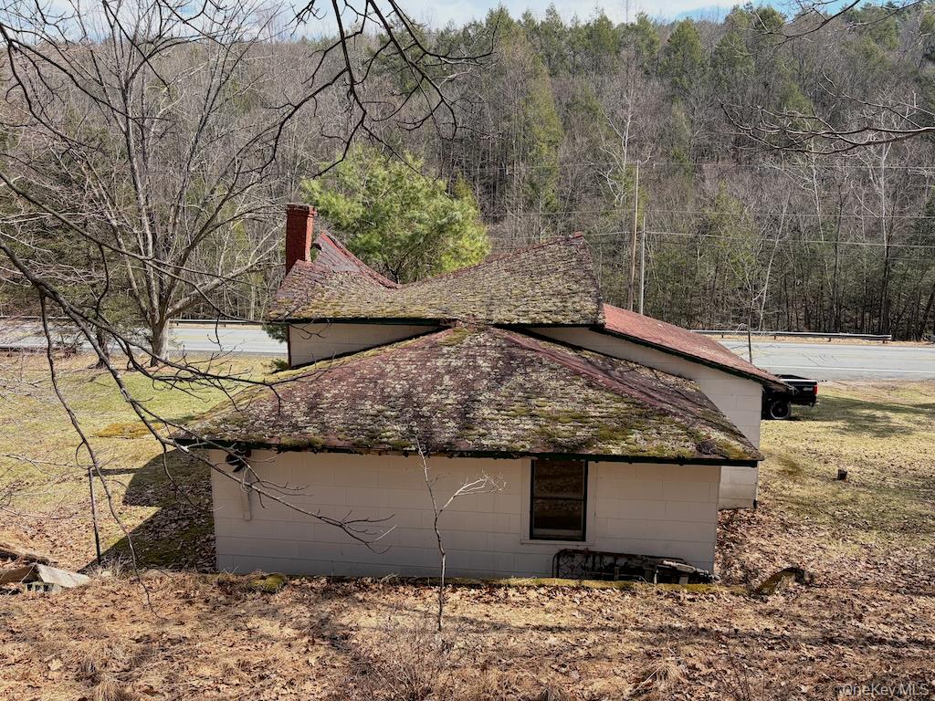 143 State Rte 55 Barryville, NY 12719 - Photo 3 of 8 a view of a backyard that has white house