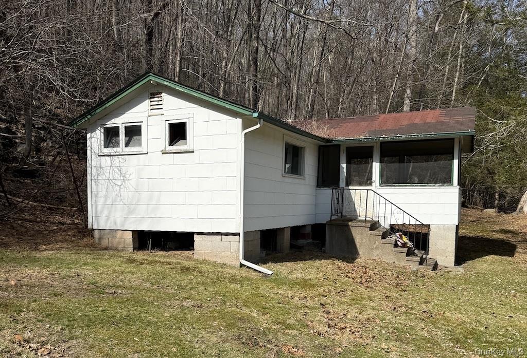 143 State Rte 55 Barryville, NY 12719 - Photo 4 of 8 a white house that has a tree in front of it