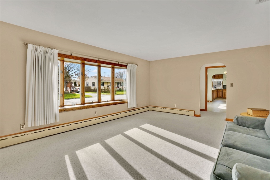 76 Roy Street Chicopee, MA 01013 - Photo 17 of 30 a view of a living room hardwood floor and a large window